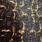 Giacca a cappa in tweed nero e oro con cintura