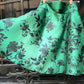 Gonna Valentina corta verde con fiori neri tessuto Douchesse