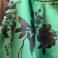 Gonna Valentina corta verde con fiori neri tessuto Douchesse