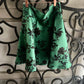 Gonna Valentina corta verde con fiori neri tessuto Douchesse